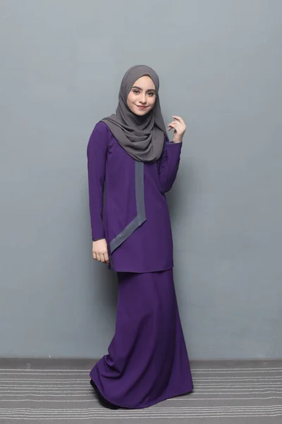 Hijab fashion.Cute Muslim girl wearing Hijab and traditional cloth.Fashion for eid celebration.