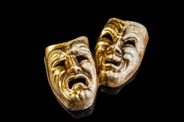 iki gülümseme ve siyah bir zemin üzerine üzüntü maske