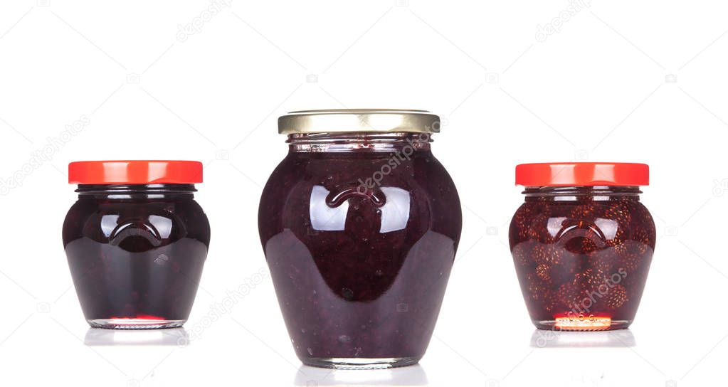 Blueberry jam in closed jar isolated on white background.