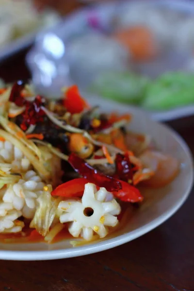 A delicious spicy papaya salad with seafood in thaifood — Stock Photo, Image