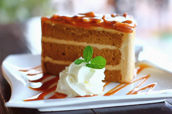 Piece of chocolate cake on a white plate — Stock Photo, Image