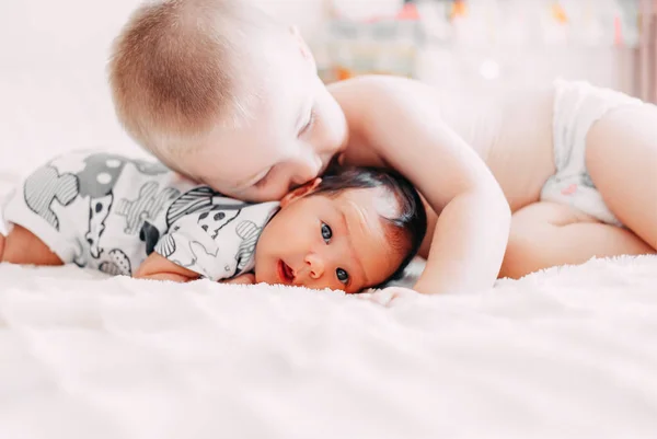 Elder Brother Blonde Hair Kiss Baby Sister Lying Bed Home — Stock Photo, Image