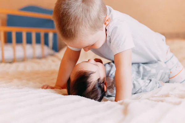 Elder Brother Playing Newborn Cute Boy Lovingly Playing His Baby — Stock Photo, Image