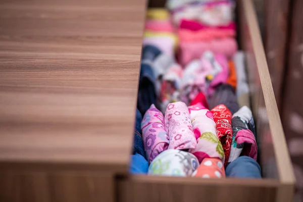 Vertical storage of clothing. Clothing folded for vertical storage in the linen drawer