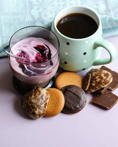 still life with a curd dessert, a cup of coffee and sweets