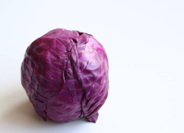 juicy red cabbage on a white background close up