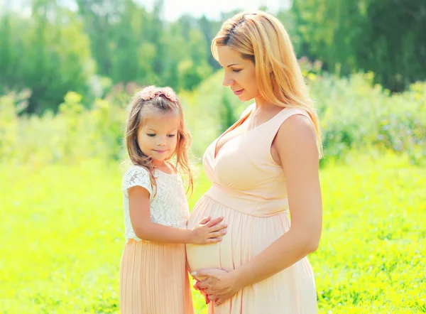 Pregnancy and family concept - happy pregnant woman, little chil — Stock Photo, Image