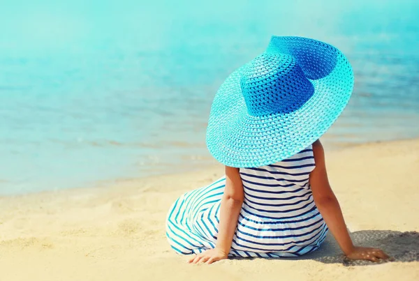 Summer holidays and vacation concept - little girl in striped dr — Stock Photo, Image