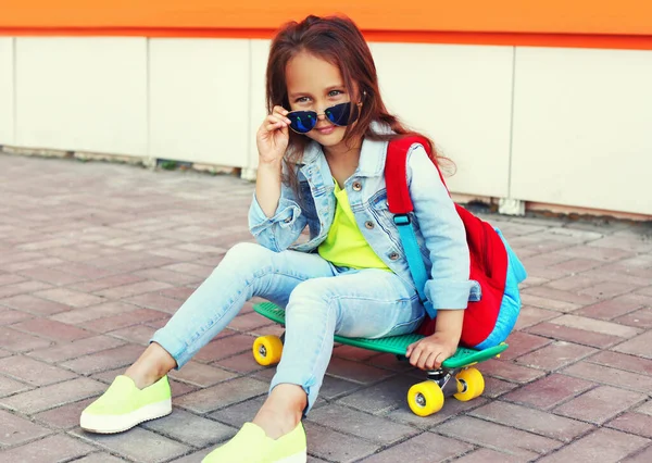 Portrait Little Girl Child Sitting Skateboard Backpack City Street — Stock Photo, Image