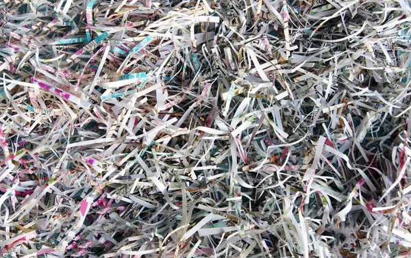 Finely shredded paper. Background. Paper texture. Office.