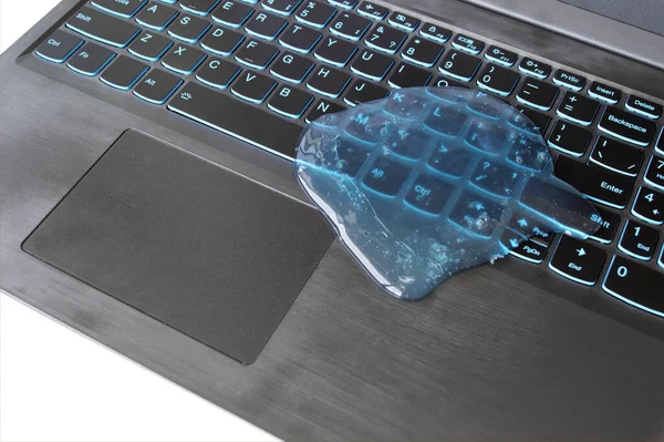 Blue soft gel cleaning dust on keyboard. Concept cleaning your computer\'s keyboard. Office cleaning.
