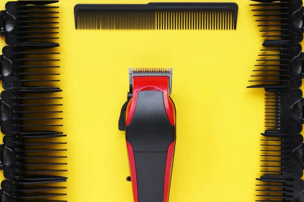 Hairdressers Tool Hair Clipper Close Yellow Background Nozzles Different Sizes — Stock Photo, Image