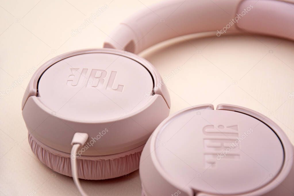 Kharkiv, Ukraine, July 06, 2023: JBL T500 Pink wired headphones with deep bass.
