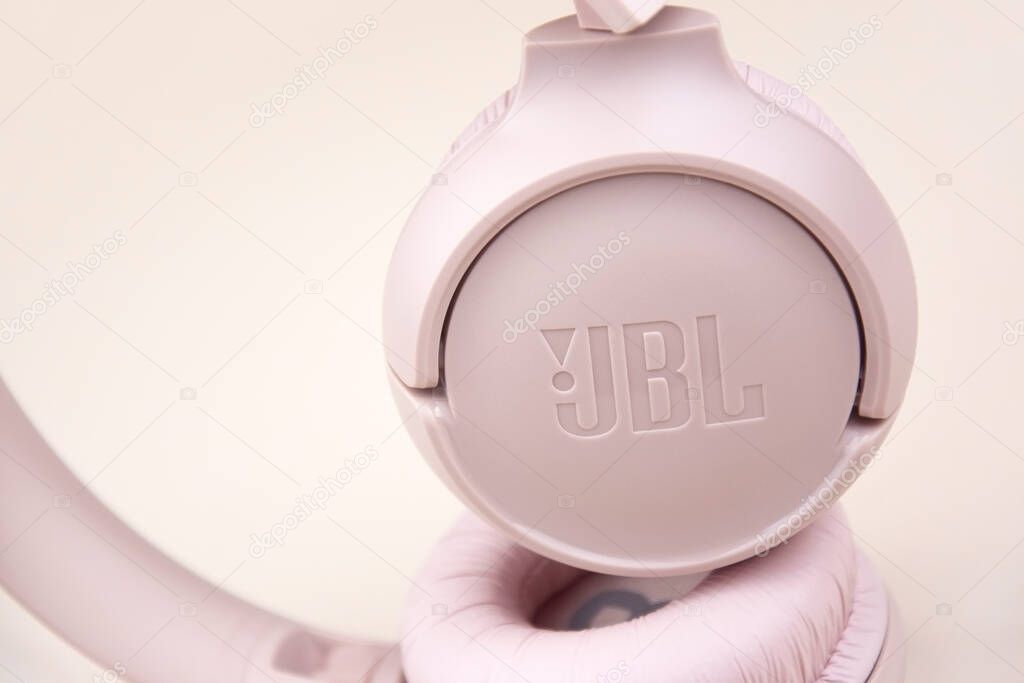 Kharkiv, Ukraine, July 06, 2023: JBL T500 Pink wired headphones with deep bass.