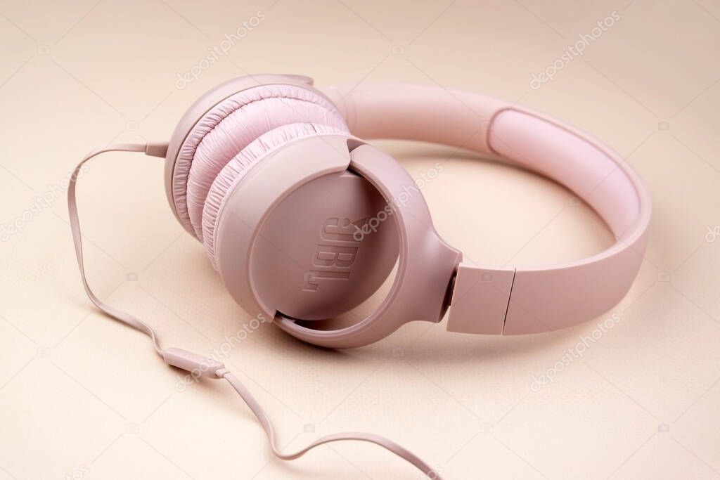 Kharkiv, Ukraine, July 06, 2023: JBL T500 Pink wired headphones with deep bass.