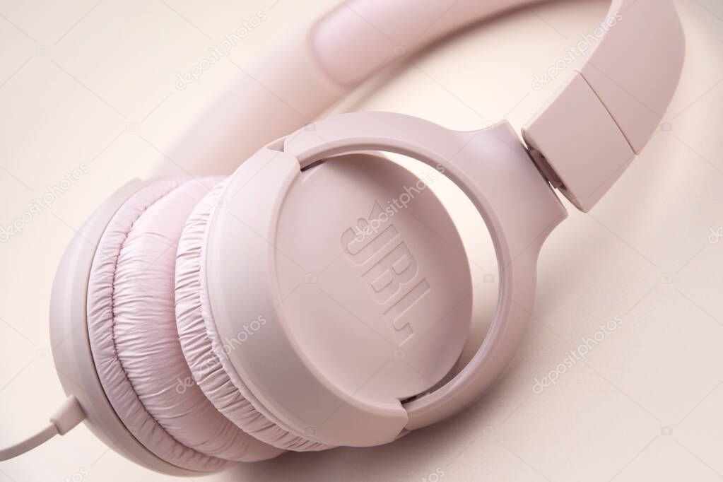 Kharkiv, Ukraine, July 06, 2023: JBL T500 Pink wired headphones with deep bass.