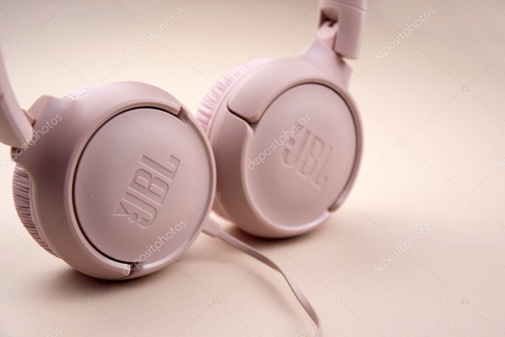 Kharkiv, Ukraine, July 06, 2023: JBL T500 Pink wired headphones with deep bass.