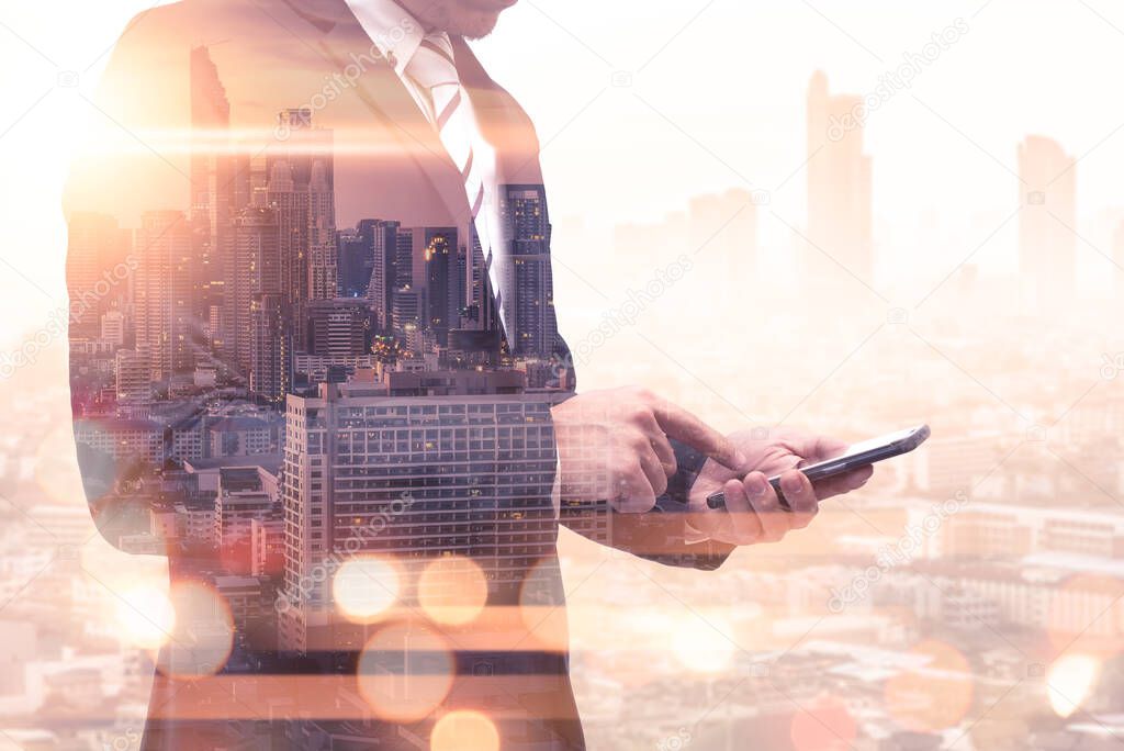 double exposure of businessman using tablet and mobile phone