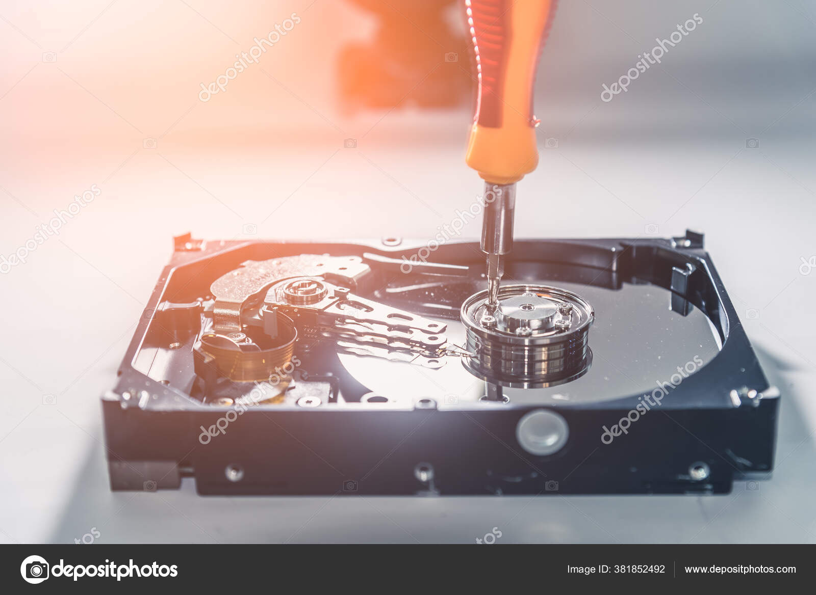 Abstract Image Technician Repairing Hard Disk Drive Screwdriver