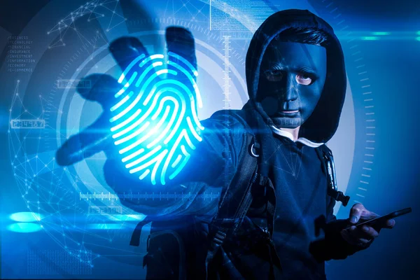 The abstract image of the hacker using a smartphone computer and reach hand for stealing the fingerprint hologram. the concept of cyber attack, virus, malware, illegally and cyber security.