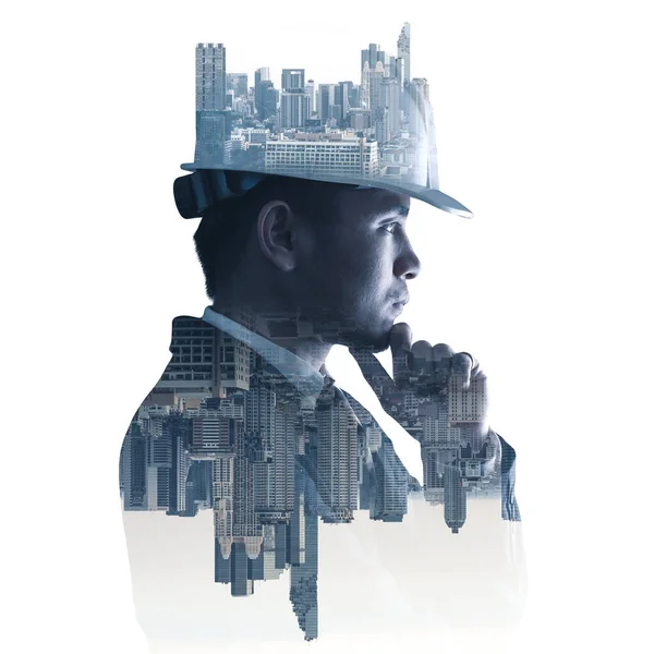 Gündoğumu sırasında kentin görüntüsüyle örtüşen mühendisin çift pozlama görüntüsü. Mühendislik, inşaat, şehir hayatı ve gelecek kavramı..