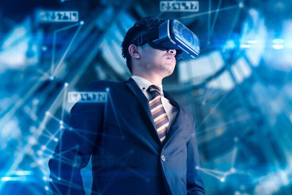 asian businessman wearing virtual goggles on futuristic background, innovation concept 