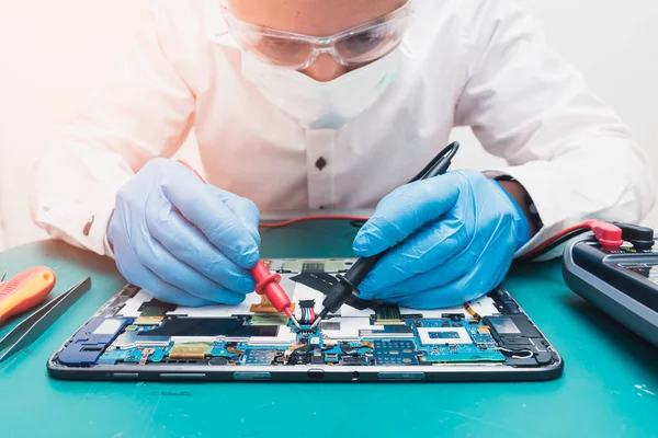 The technician repairing the computer. the concept of computer hardware, repairing, upgrade and technology.