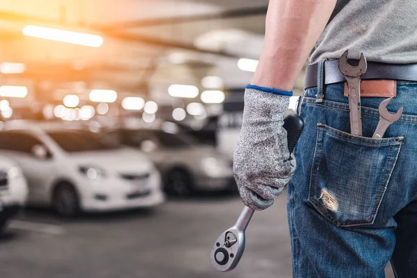 Abstract Image Back Technician Hold Wrench Blurred Garage Backdrop Concept – stockfoto