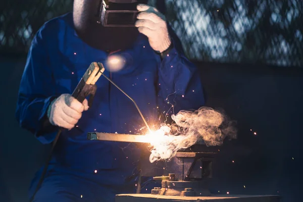 The worker working via the welding method. the concept of welding, machinery, industrial4.0 and manufacturing.