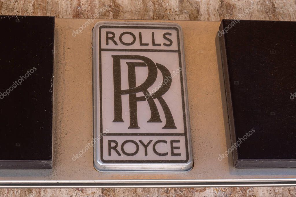Monte Carlo, Monaco - July 4, 2020: Sign and Logo of Rolls Royce on the store of luxury cars