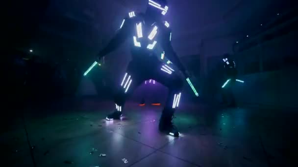 Led Show. People dance in light costumes. Slow motion — Stock Video