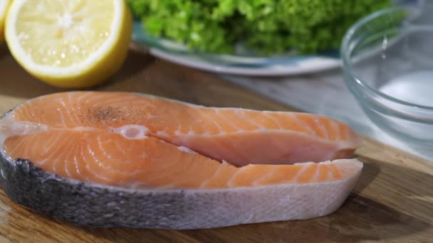 Peppers slowly fall into a piece of salmon — Stock Footage Peppers slowly fall into a piece of salmon Royalty Free Stock Video
