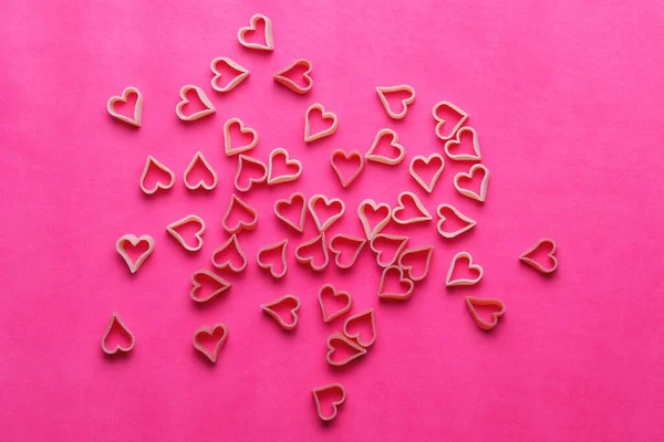 Heart from small hearts on a pink background for Valentine\'s Day