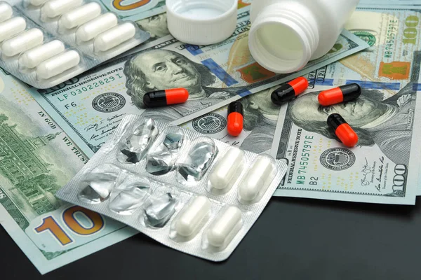 medical pills and money on the table