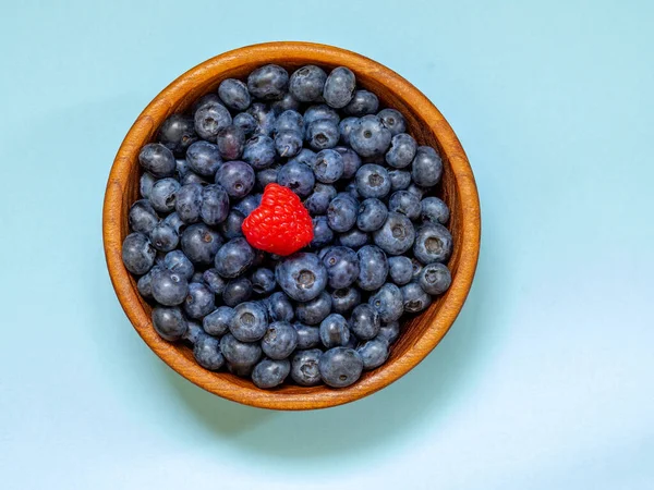 Gifts of the summer garden, raspberries and blueberries. Vitamins and summer