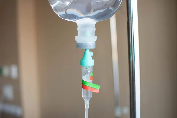 Saline bag labeled with the name of the patient in the emergency room at the hospital.