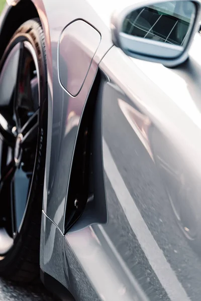 Alesund / Norveç - 31 Mayıs 2020: Otoparkta park etmiş gümüş renkli Porsche Taycan Sedan. Dış detay. Yakın çekim.. 