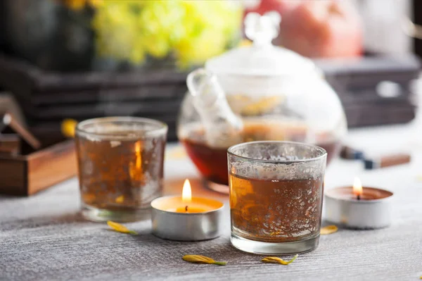 Glasses Lit Candles Tea Pot Wooden Background — Stock Photo, Image