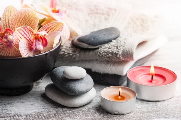 Spa Still Life Pebbles Red Orange Orchid Lit Candle Wooden — Stock Photo, Image