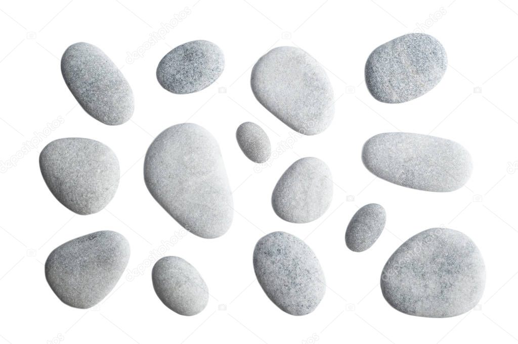 Grey pebbles isolated on white background.  Top view of sea stone