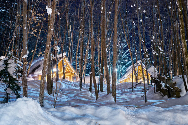 Beautiful boutique cottages with snow weather in winter at Ninguru terrace in Furano city, Hokkaido, Japan.