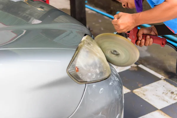 Worker polish the car by Car polishing machine