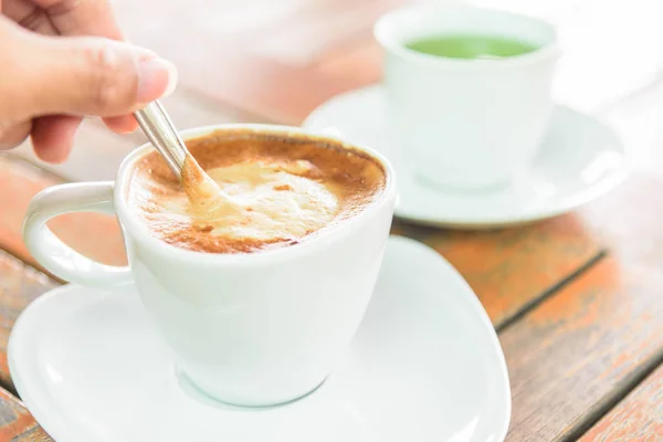 stir the coffee in cup before drink