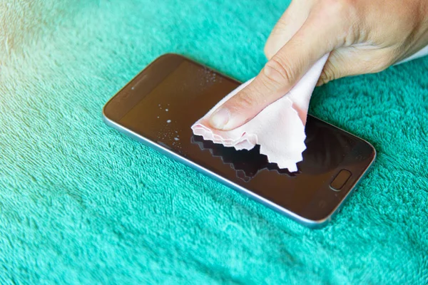 cleaning mobile phone screen by microfiber cloth. Before apply the smart phone screen protect flim