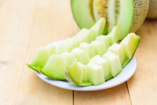 Fresh Green melon on the wood plate