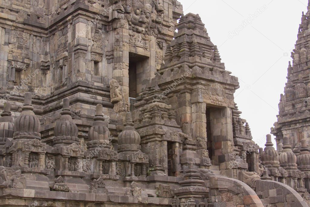 Detail of entrance in tower at famous Prambanan hindu temple, Yogyakarta, Java, Indonesia. Candi Prambanan - Stone structures and rubble at iconic travel destination