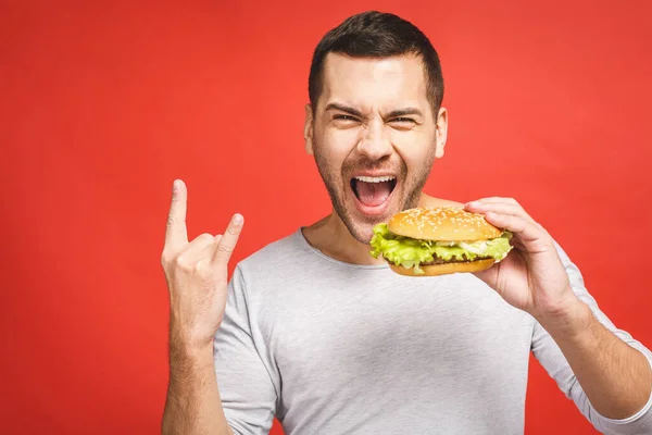 Unge Man Som Håller Bit Hamburgare Studenten Äter Snabbmat Burger — Stockfoto