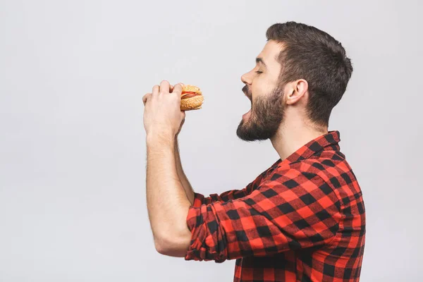 Unge Man Som Håller Bit Hamburgare Studenten Äter Snabbmat Burger — Stockfoto