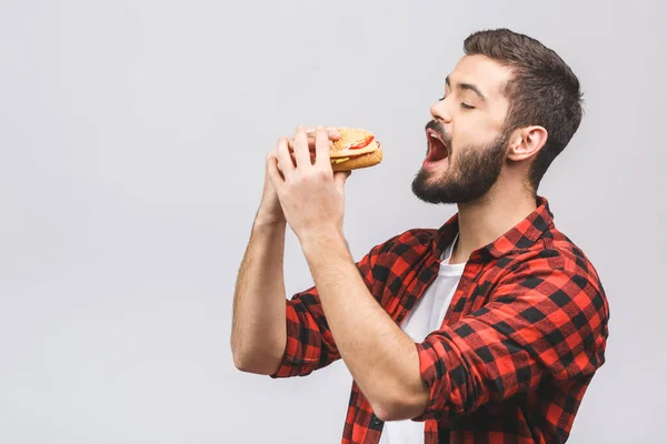 Unge Man Som Håller Bit Hamburgare Studenten Äter Snabbmat Burger — Stockfoto