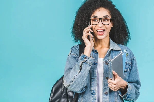 African american black student woman using smartphone standing over isolated over blue background.